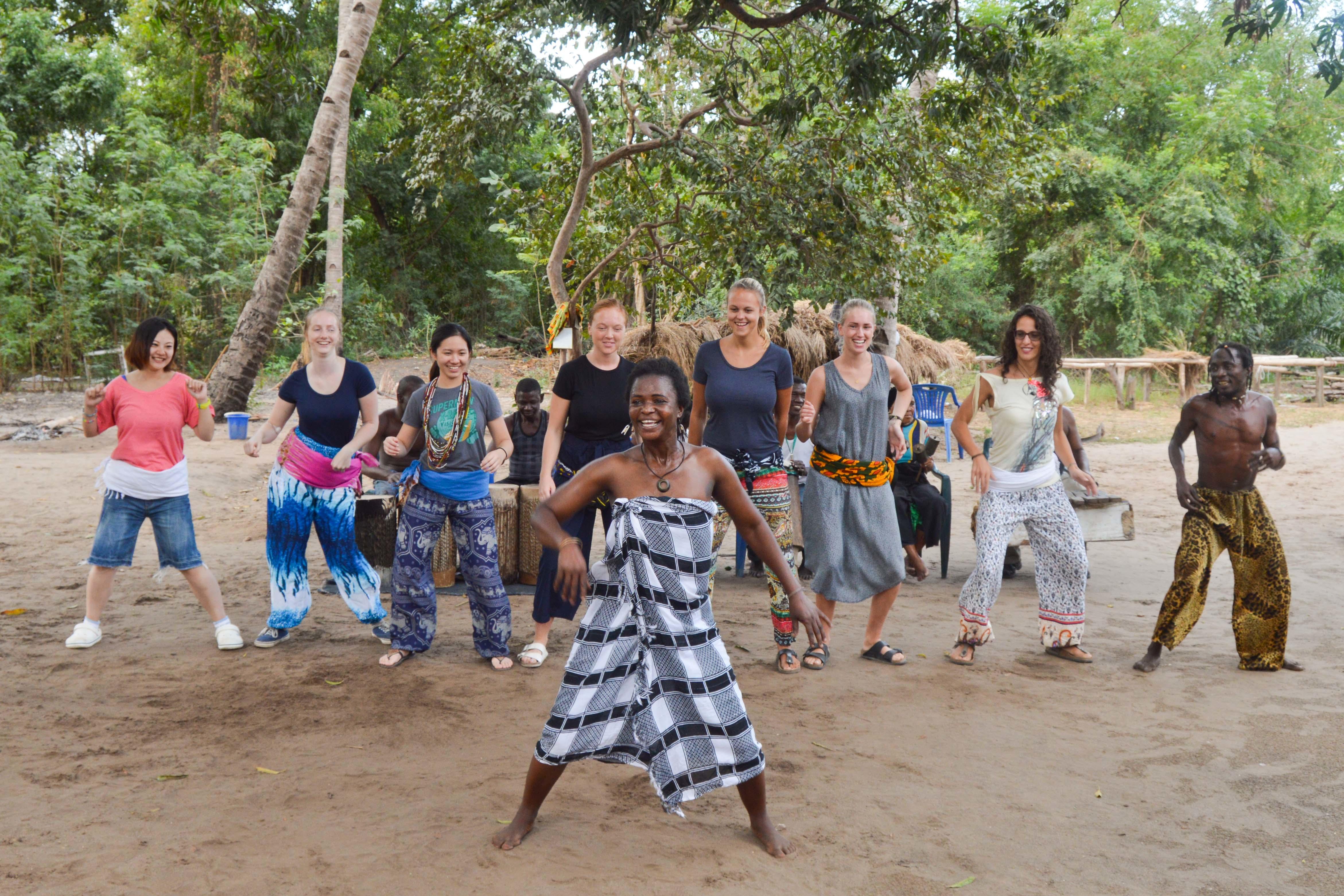 Teenage volunteers working with children in Tanzania learn about the Maasai through Projects Abroad's arranged cultural activities Volunteers learn about local culture during volunteer work in Tanzania for teenagers